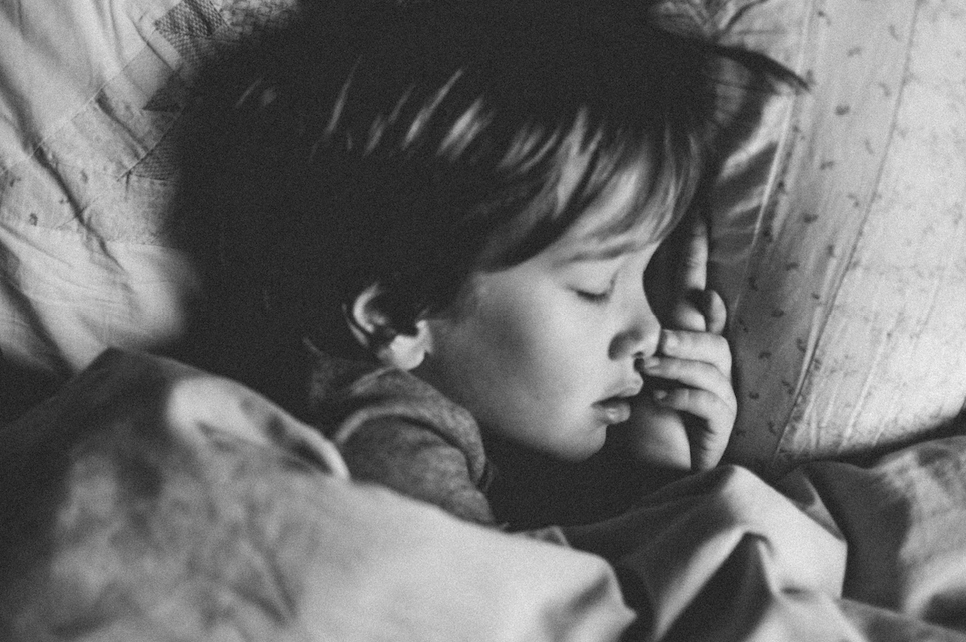 Child sleeping on a pillow
